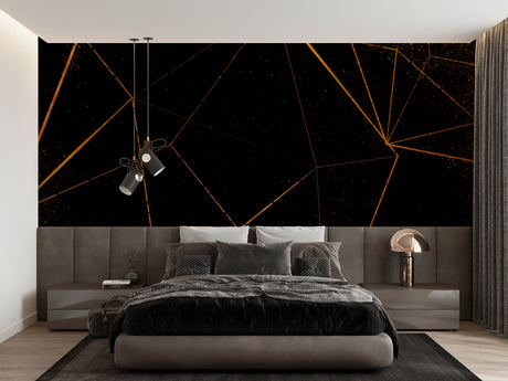 Black and gold geometric wallpaper in modern living room with tall windows and grey sofa