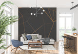 Modern home office featuring black and gold linear wallpaper with desk setup