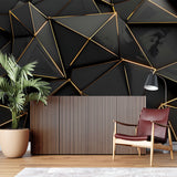 Geometric black and gold wall mural in an elegant master bedroom with ambient lighting