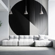 Modern geometric circle wallpaper creating a bold statement wall in a minimalist living room with natural lighting