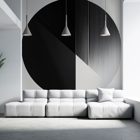 Modern geometric circle wallpaper creating a bold statement wall in a minimalist living room with natural lighting