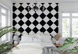 Geometric black and white wallpaper making a bold statement in a dining room