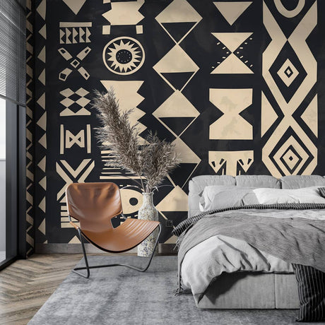 Geometric tribal wallpaper in modern minimalist living room showing black and white pattern creating dramatic contrast