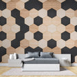 Modern Geometric Hexagon Wallpaper showcased in a minimalist living room with black and wood tones