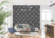 Black geometric Art Deco wallpaper in modern living room with grey sofa and minimalist decor