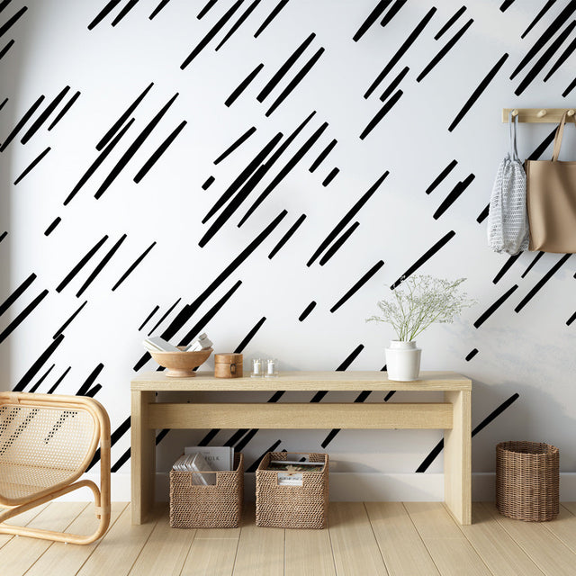 Black geometric line pattern wallpaper in a modern minimalist living room with natural light and contemporary furniture