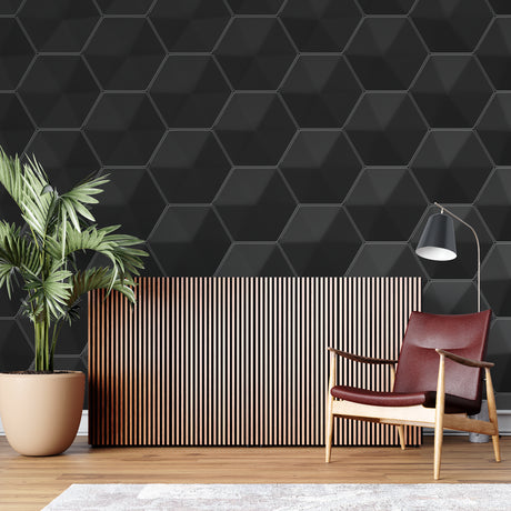 Black geometric wallpaper in modern living room showing 3D hexagon pattern casting subtle shadows on feature wall