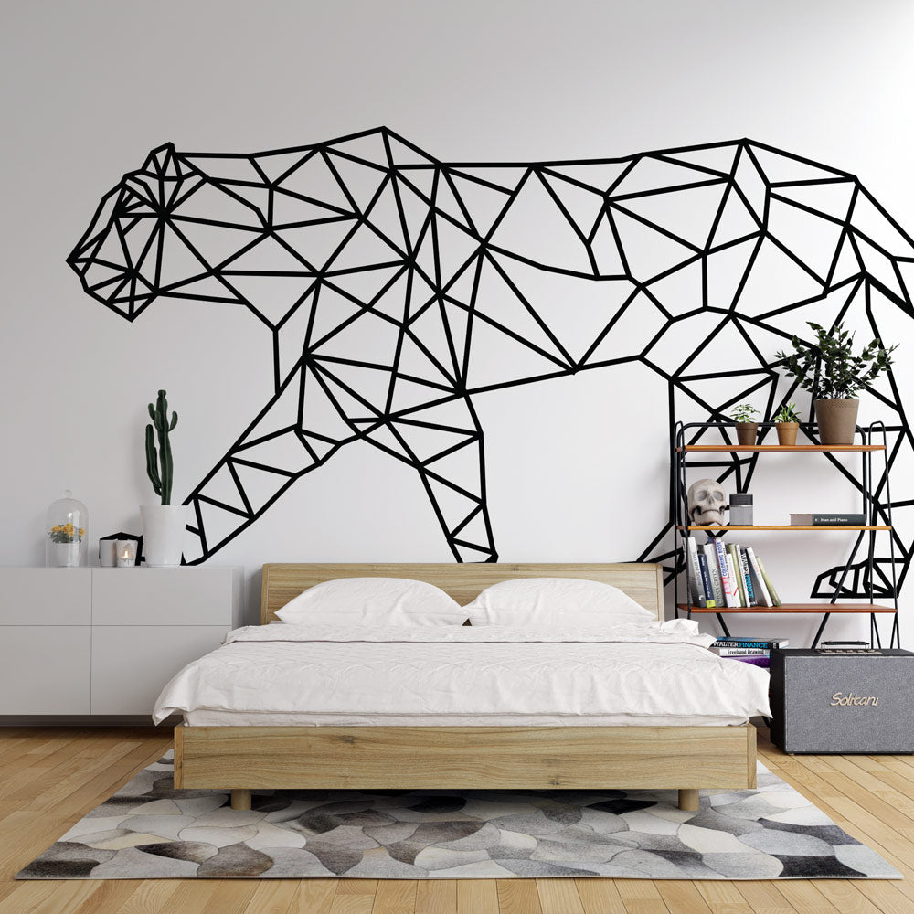 Geometric black panther line art wallpaper making a bold statement in a minimalist living room with white furniture