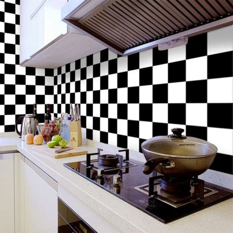 Black and white geometric wallpaper in modern kitchen showing clean lines and bold pattern
