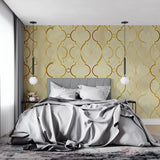 Gold pattern wallpaper creating depth in home office with natural light streaming through windows