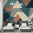 Modern geometric wallpaper creating a bold statement in a minimalist living room with teal and terracotta accents