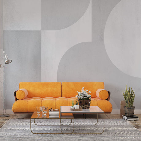 Modern Art Deco geometric wallpaper creating an elegant statement wall in a minimalist living room with curved furniture