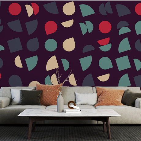 Modern geometric wallpaper in purple and sage green bringing depth to a minimalist living room setting