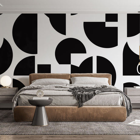 Modern black and white geometric wallpaper creating visual impact in a minimalist living room setting