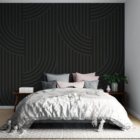 Modern geometric wallpaper with black curved lines creating depth in a minimalist living room setting