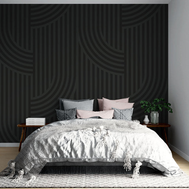 Modern geometric wallpaper with black curved lines creating depth in a minimalist living room setting