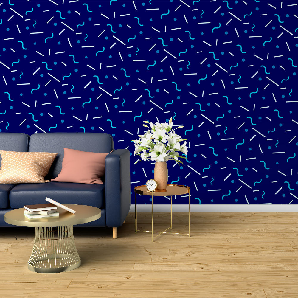 Modern geometric blue wallpaper creating depth in a minimalist living room with natural light