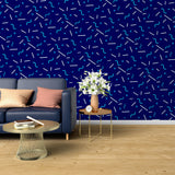 Modern geometric blue wallpaper creating depth in a minimalist living room with natural light