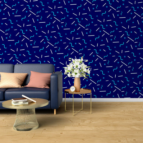 Modern geometric blue wallpaper creating depth in a minimalist living room with natural light
