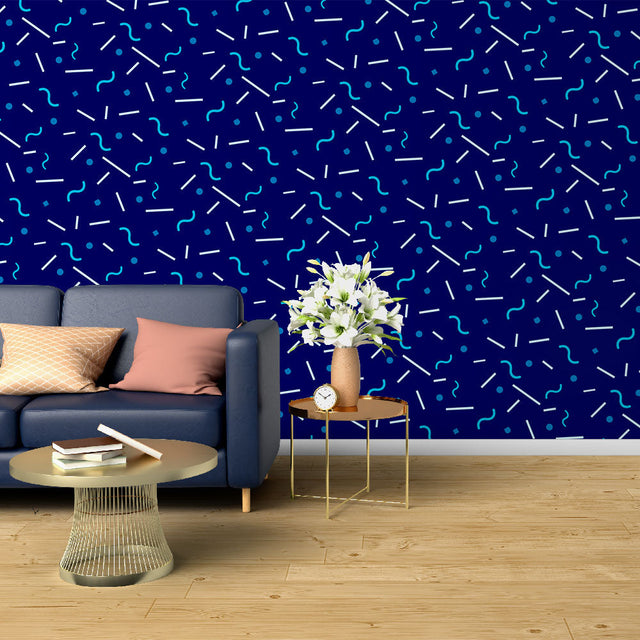 Modern geometric blue wallpaper creating depth in a minimalist living room with natural light
