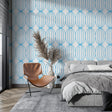 Modern blue geometric wallpaper in a bright living room showing flowing circle pattern
