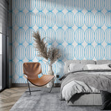 Modern blue geometric wallpaper in a bright living room showing flowing circle pattern