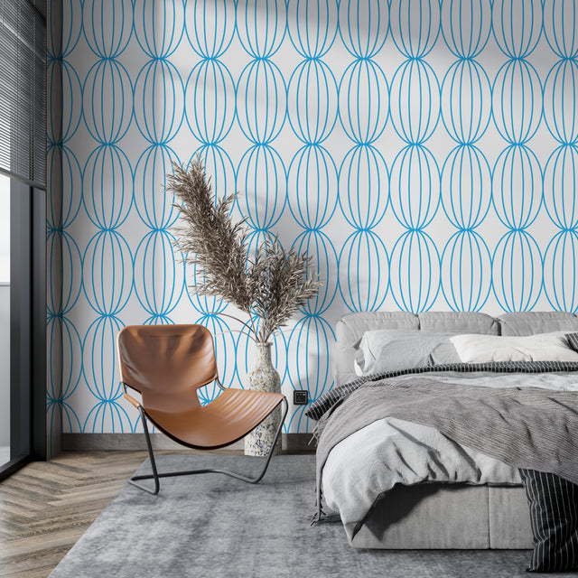 Modern blue geometric wallpaper in a bright living room showing flowing circle pattern