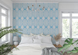 Blue circle pattern wallpaper in home office creating a fresh workspace