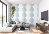 Geometric blue circle wall design in a contemporary bedroom setting