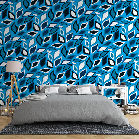 Modern geometric leaf wallpaper in blue and white creating a fresh look in a bright living room with minimal furniture