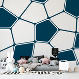 Modern geometric wallpaper in bright home office with white desk and natural light