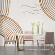 Modern geometric wallpaper with brown curved lines in a bright living room setting