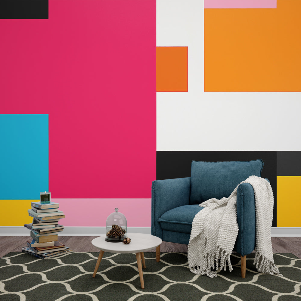 Geometric color block wallpaper mural in bright modern living room with minimalist furniture and natural light