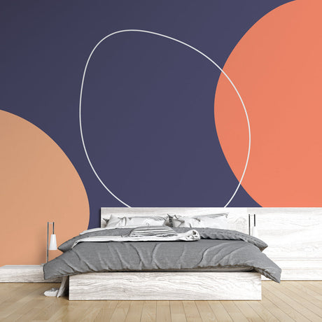 Modern geometric circle wallpaper creating a bold statement wall in a minimalist living room with coral and navy tones