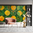 Modern geometric circle wallpaper in a bright living room showing green and orange spheres