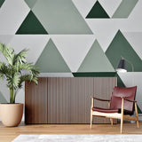 Modern green geometric wallpaper in bright living room with minimalist furniture