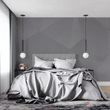 Modern grey geometric wallpaper in minimalist living room showing clean lines and contemporary design