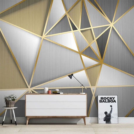 Modern geometric wallpaper with gold lines in a bright living room setting showing depth and luxury