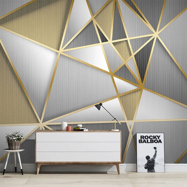 Modern geometric wallpaper with gold lines in a bright living room setting showing depth and luxury