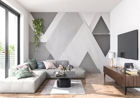 Modern geometric grey wallpaper in a minimalist living room with natural light and clean furniture lines