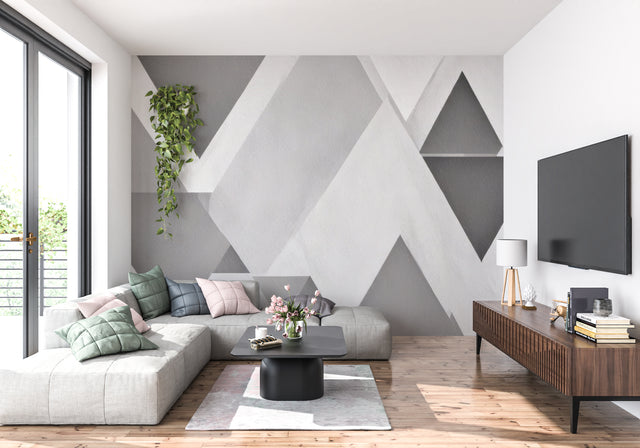 Modern geometric grey wallpaper in a minimalist living room with natural light and clean furniture lines