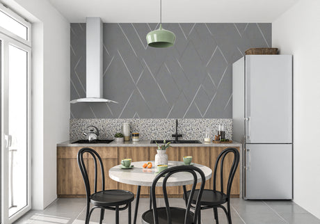 Modern grey geometric wallpaper in a bright living room, creating depth with diamond patterns