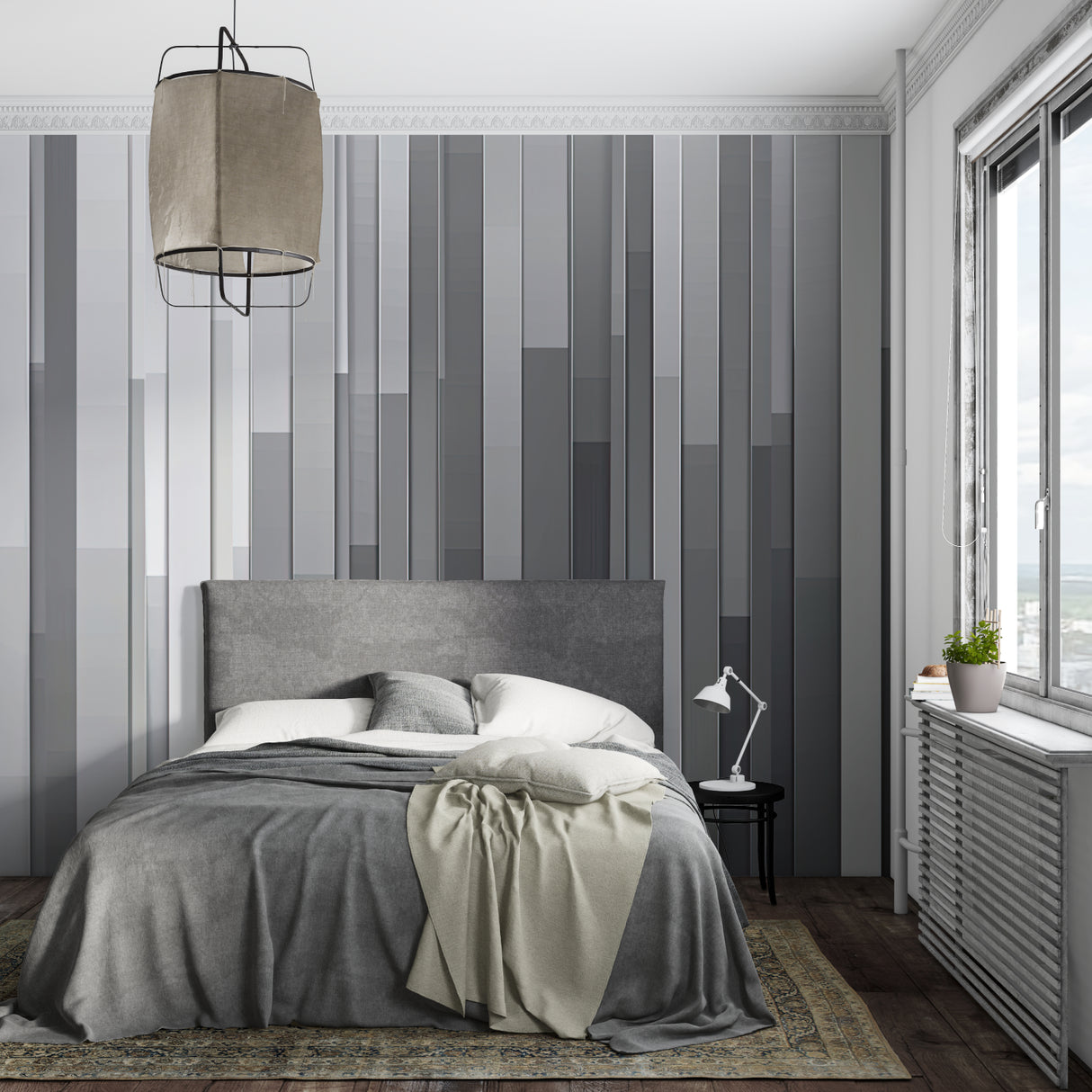 Modern grey stripe wallpaper in a minimalist living room with natural light highlighting the gradient pattern