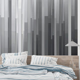 Grey geometric wallpaper creating height in a modern office space with sleek furniture