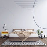 Modern geometric line art wallpaper in a bright, minimalist living room showing curved patterns and clean lines