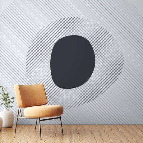 Modern geometric wallpaper creating depth in a minimalist living room with natural light and clean furniture arrangement