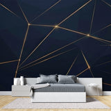 Modern office featuring geometric navy blue and gold wallpaper on accent wall