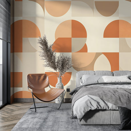 Modern orange geometric wallpaper in bright living room with grey sofa and natural light