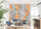 Modern geometric wallpaper with orange and grey design showcased in a minimalist living room setting