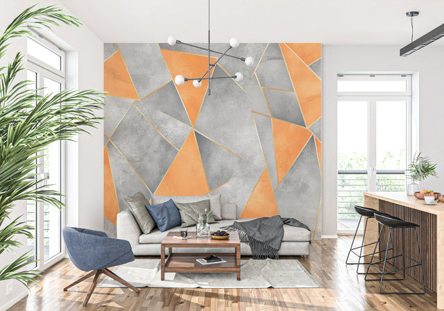 Modern geometric wallpaper with orange and grey design showcased in a minimalist living room setting